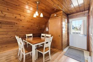 a dining room with a table and chairs at Chalet #16 in Stevensville