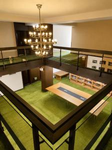 an overhead view of a living room with a chandelier at The Square Central Prishtina in Prishtinë