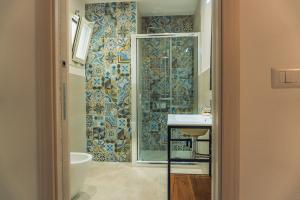a bathroom with a shower and a sink at ADA Apartment in Porto Cesareo +51 photos
