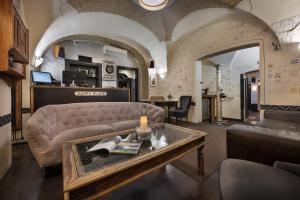 a living room with a couch and a table at U Schnellu in Prague +25 photos