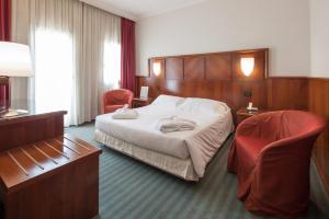 Tempat tidur dalam kamar di Hotel Antico Mulino