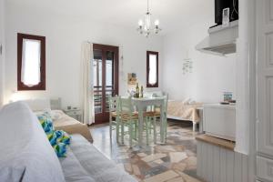 a living room with a kitchen and a dining room at Apartment with sea view - Creta in Ferma