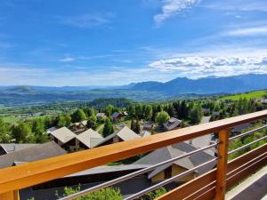 a view from the balcony of a house at Grand appartement pour 12 pers. avec balcon sud, WIFI, parking et proche pistes – St Michel de Chaillol - FR-1-393-11 in Saint-Michel-de-Chaillol