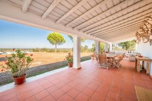 an outdoor patio with a table and chairs at Authentic Alentejo Farmhouse in Arraiolos