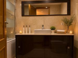 a bathroom with a sink and a mirror at Villa María Arrecife Beach in Arrecife