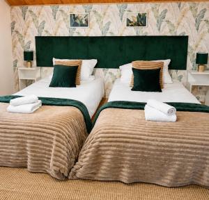 two beds sitting next to each other in a room at KRK stop near airport in Cholerzyn