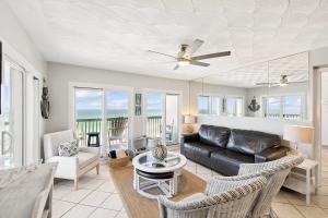 a living room with a couch and chairs at Emerald Hideaway by 30A Escapes in Carillon Beach