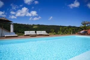 a swimming pool with two lounge chairs next to at Quinta da Abelheira 1660 in Sobral da Abelheira +31 photos