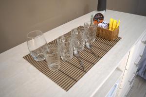 a bunch of glasses on a drying rack on a counter at Hotel SMA in Puerto Iguazú +49 photos
