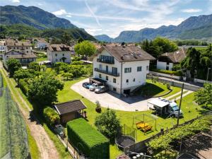 an aerial view of a large white house with a yard at Rauchhof Apartments in Auer