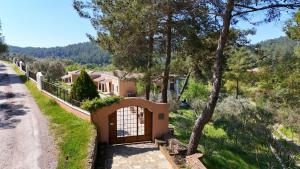 a house with a gate on the side of a road at D&C Göcek Hotel in Göcek