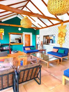 a living room with couches and a table at Xalli Beach Hotel in Altagracia +41 photos
