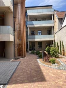 a brick walk way in front of a building at Loft Sous Pref in Montbéliard