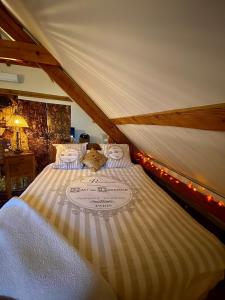 a bed in a tent with lights on it at La maison des jours heureux in Leysse