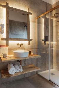 a bathroom with a sink and a mirror and a shower at Locanda delle rose in Roccavaldina +102 photos