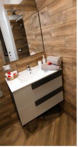 a bathroom with a sink and a mirror at Elite in Monte Compatri