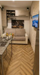 a living room with a couch and a table at Elite in Monte Compatri