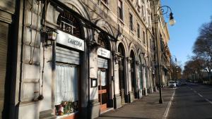a row of buildings on a city street at 0.3 Stanze in Trieste