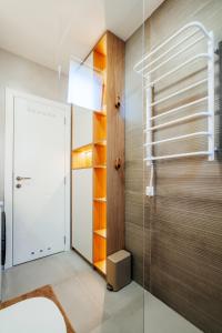 a bathroom with a glass shower and a glass door at Maria Premium BELLA VISTA in Baošići +28 photos