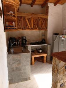 a kitchen with a sink and a refrigerator at Alma de Acero in Envigado +9 photos