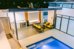 an overhead view of a house with a swimming pool at Amethyst Bcd in Bacolod