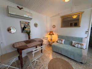 a living room with a couch and a table at casa serena in Lumio