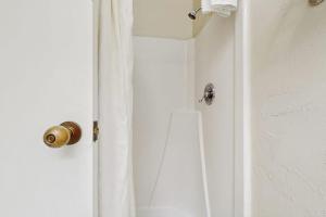 a white door with a gold door knob on it at Seasons 307 in Warren +9 photos