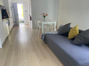 a living room with a couch and a table at Ria & Mar Collection I in Aveiro +49 photos