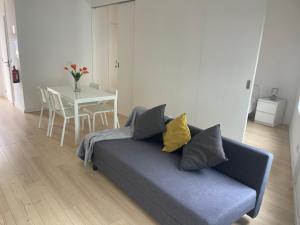 a living room with a couch and a table at Ria & Mar Collection I in Aveiro