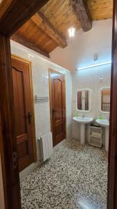 a bathroom with a sink and a mirror at Albergue La Cuba in La Cuba +55 photos