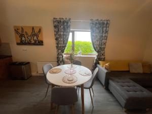 a living room with a table and a couch at Atlantic way Apartment in Sligo
