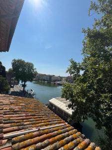a view of a river from the roof of a building at La Galiote in Agde