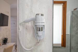 a security camera on the wall of a bathroom at L'Aurora Porto Torres in Porto Torres +67 photos