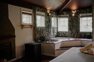 a kitchen with a tub and a sink in a room at Villa Don in Petrópolis +102 photos