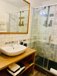 a bathroom with a sink and a shower at Une Parenthèse in Barbentane +20 photos