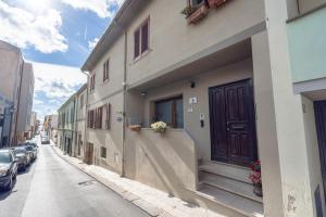 a building with a door on the side of a street at L'Aurora Porto Torres in Porto Torres