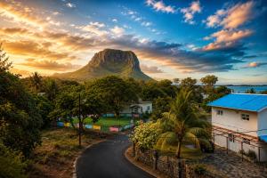 a winding road in front of a mountain at Suntoo Villa Wind & Kitesurf Accommodation in La Gaulette