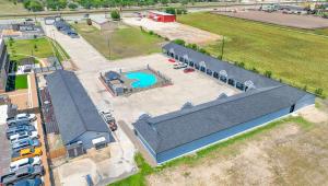 an overhead view of a building with a pool at Executive Inn Hondo in Hondo