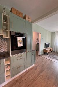 a kitchen with a large entertainment center with a tv at Casa del Sole in Dangio