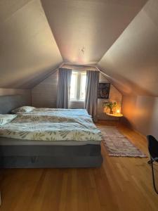 a bedroom with a bed and a window in a room at Studio by the river in Forshaga