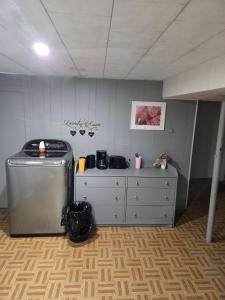 a room with a kitchen with a counter and a counter at Brossard room 3 in Brossard
