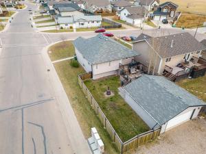 an aerial view of a house with a driveway at Executive 5 bdrm 3 ba House in Bonnyville