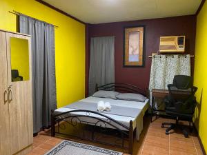 a bedroom with a bed and a desk and a chair at Maeganbeverly's Place in Santa Fe