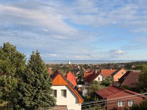 a view of a city with houses and trees at Balaton Breeze in Balatonalmádi
