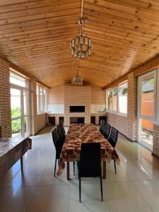 a large dining room with a table and chairs at Admiral in Koblevo