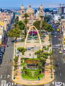 an aerial view of a city with a large arch at MiHOSTAL ELIAS in Tacna
