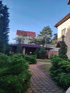 a brick walkway in front of a building at Admiral in Koblevo
