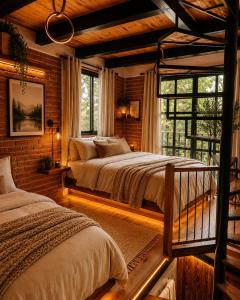 a bedroom with two beds and a window at Cielito Querido in Mineral del Chico