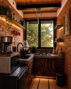 a kitchen with a stove and a window at Cielito Querido in Mineral del Chico