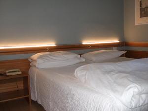 Postel nebo postele na pokoji v ubytování Hotel Canturio